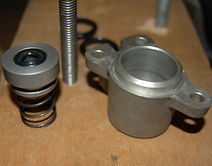 Original clutch slave, with the piston (minus seal) on the left, and the cylinder on the right. The seal fits in the groove in the piston.