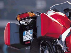 The single sided swing arm allows the underseat exhaust, which allows big panniers to be fitted without upsetting ground clearance